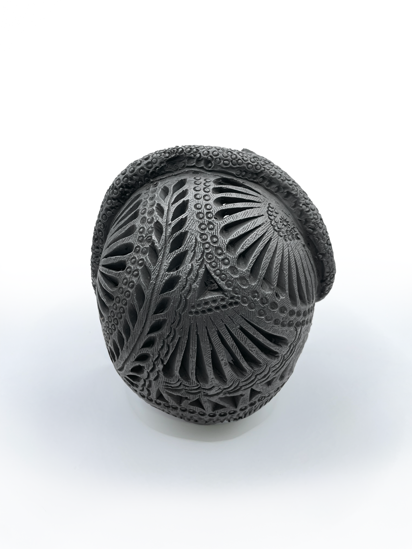Calavera con tocado de serpiente