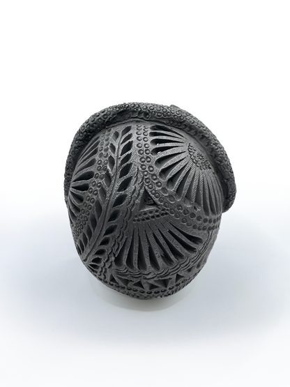 Calavera con tocado de serpiente